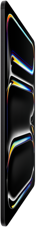 iPad Pro, parte delantera exterior, color negro espacial, carcasa de aluminio y vidrio, diseño ultrafino, inclinado hacia atrás, la pantalla muestra un dibujo multicolor